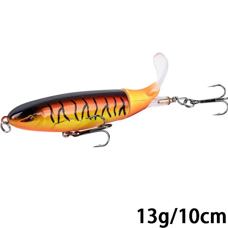 Goture Whopper Popper topwater fishing lure in orange and black, 10cm size, designed for pike fishing and explosive surface blowups.