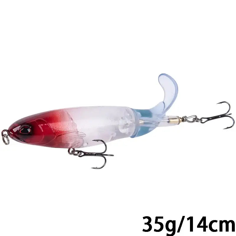 Goture Whopper Popper 14cm topwater fishing lure in transparent design with red head and rotating tail for pike fishing.