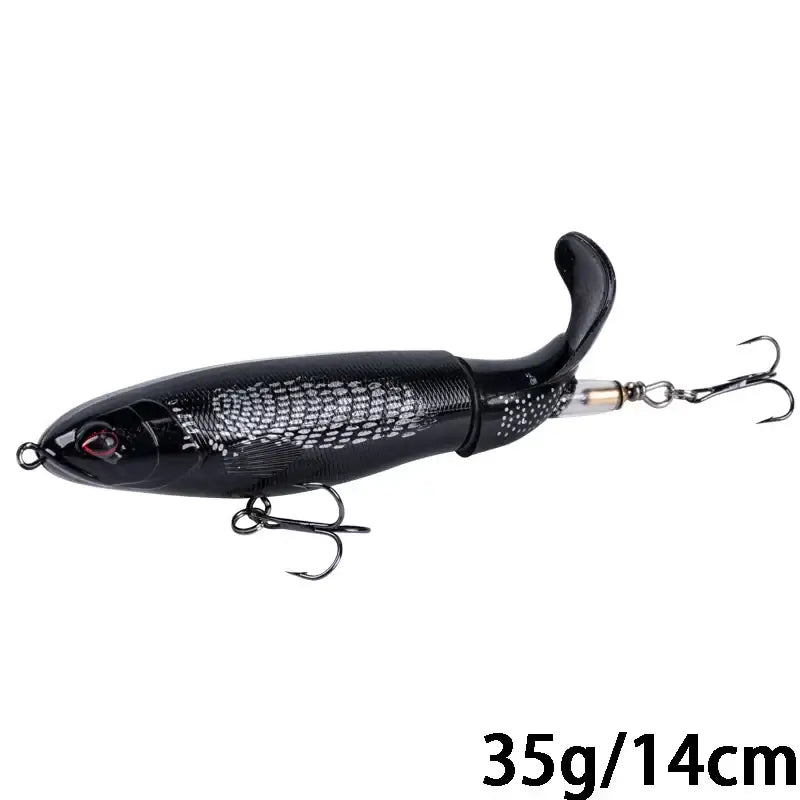 Goture Whopper Popper 14cm topwater fishing lure in black, designed for pike fishing with a rotating tail feature.