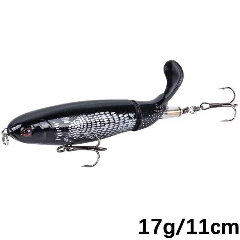 Goture Whopper Popper 11cm black topwater fishing lure with rotating tail and treble hooks for pike fishing.