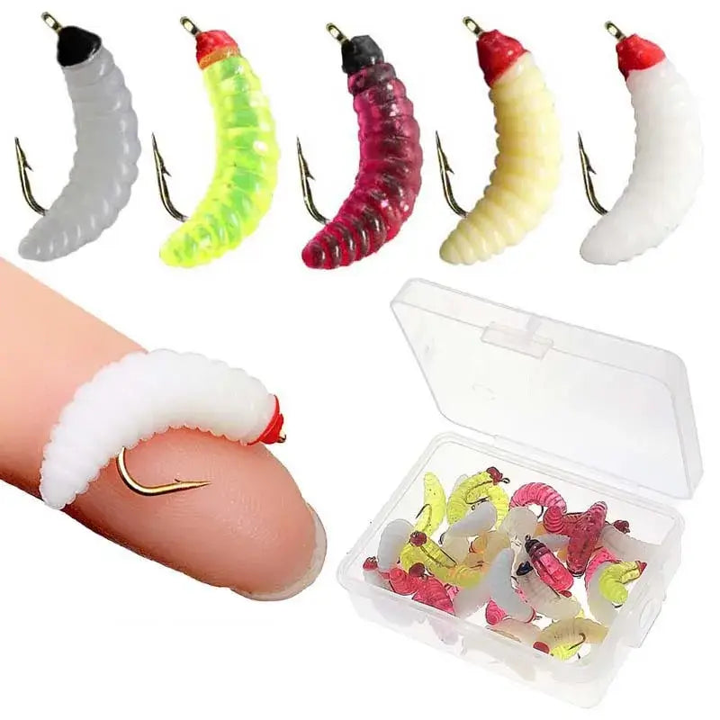 Variety of maggot fly fishing lures in multiple colors with a clear storage box, perfect for trout and bass fishing.