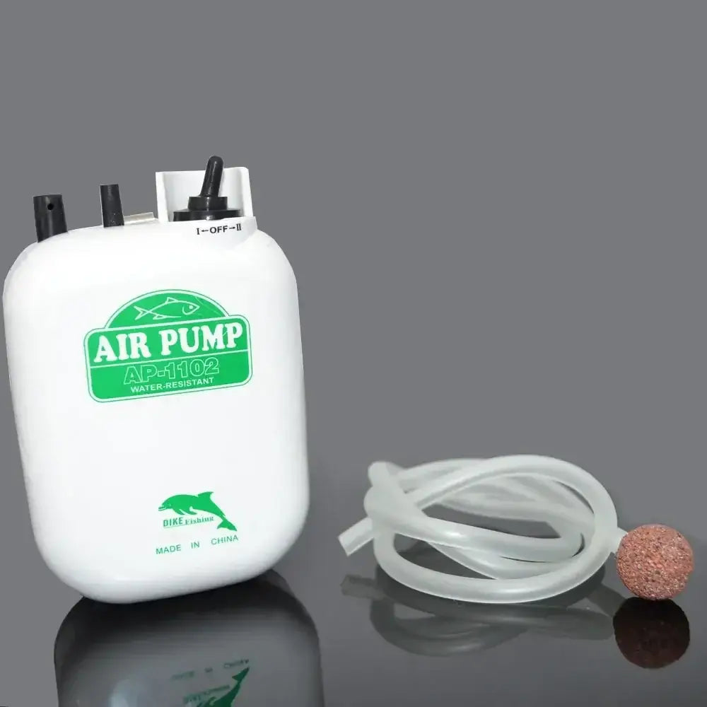 Water-resistant battery-operated air pump for fishing and aquariums, includes tubing and air stone.