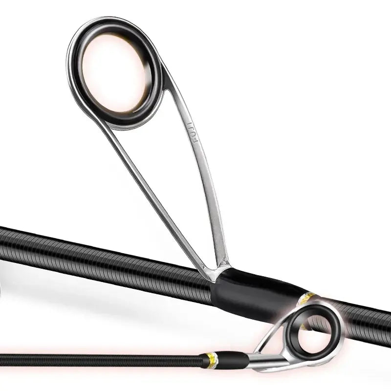 Close-up of FUJI guides on a carbon fiber fishing rod, showcasing high-quality design for smooth casting.