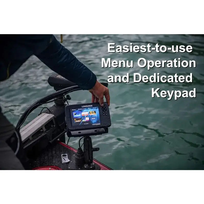 User operating Lowrance fish finder with easy menu and dedicated keypad on a fishing boat.